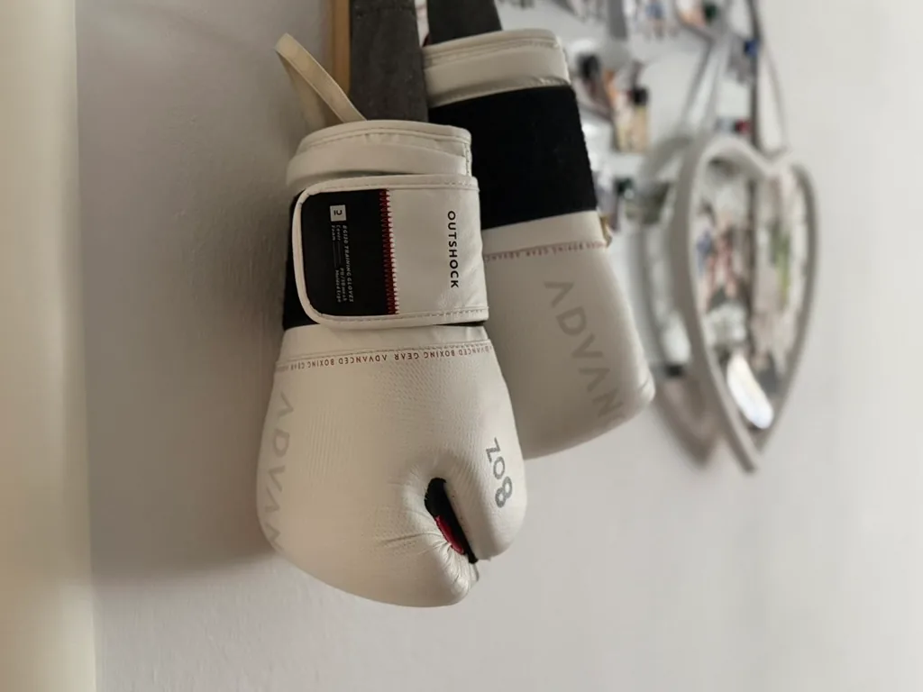 A pair of boxing gloves hanging up