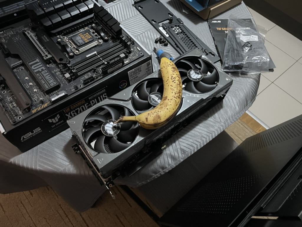A graphics card mid PC-build, with a banana for scale