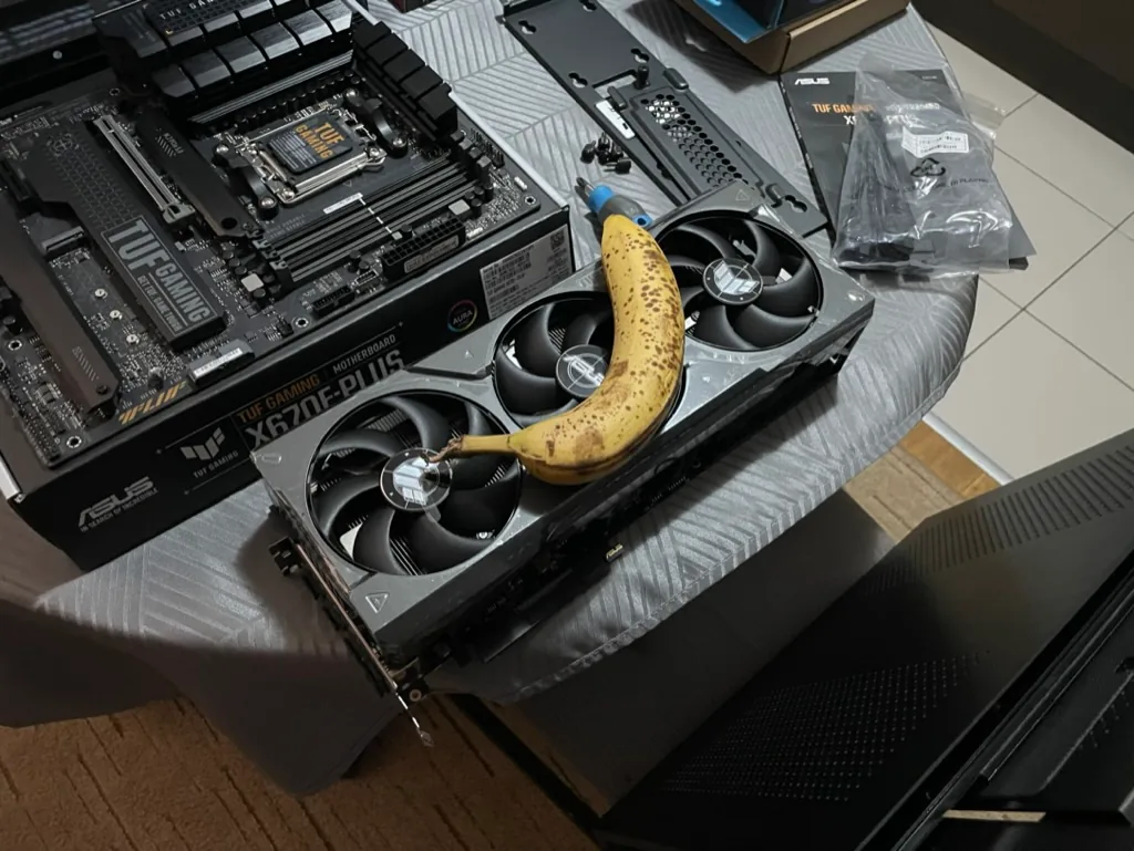 A graphics card mid PC-build, with a banana for scale